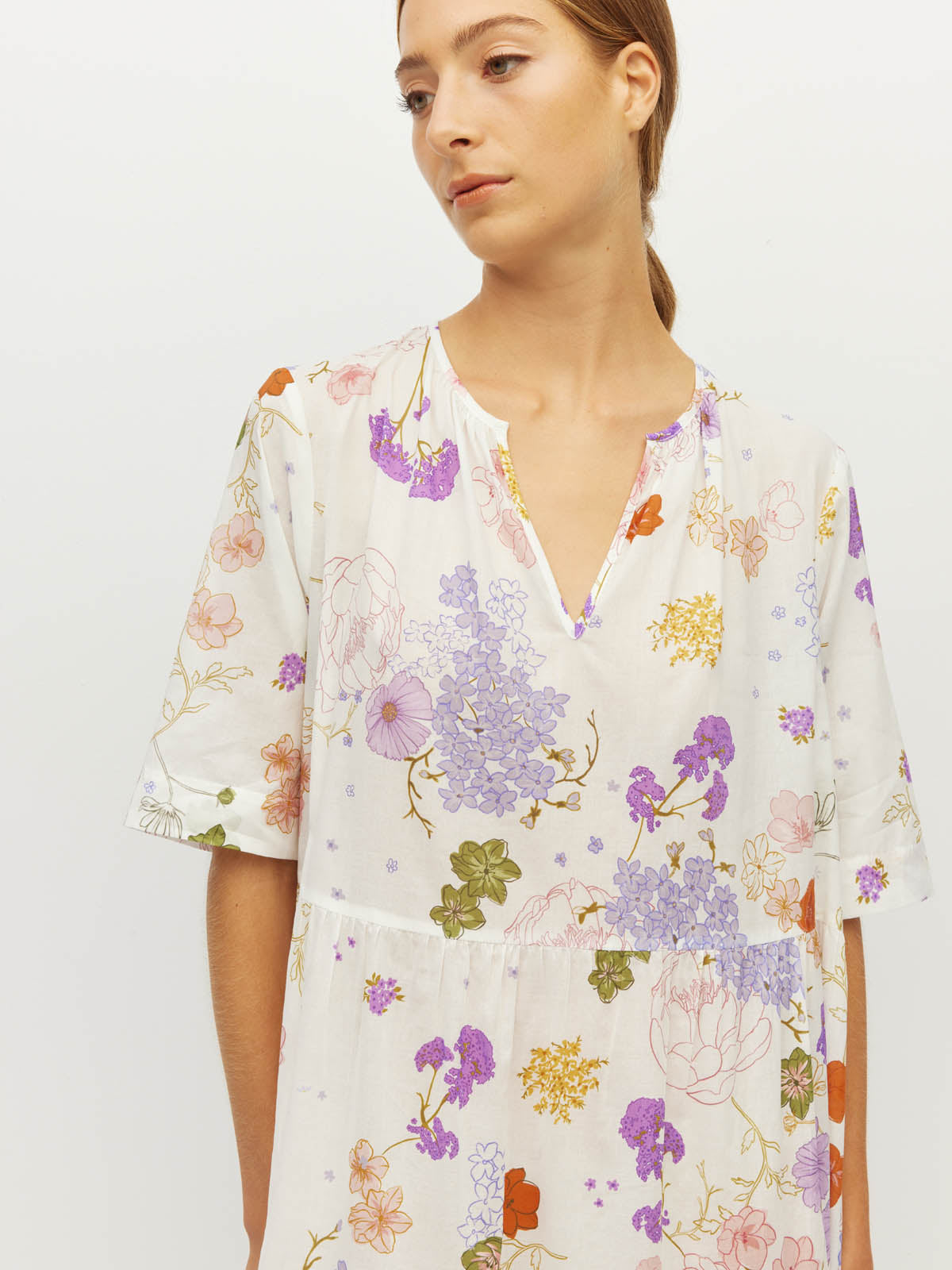 Juliette Hogan Flor Tunic (Afterglow Floral Cotton) Blanc - loose printed maxi tunic with full tiered skirt, deep V-neckline, and T-shirt style sleeves.