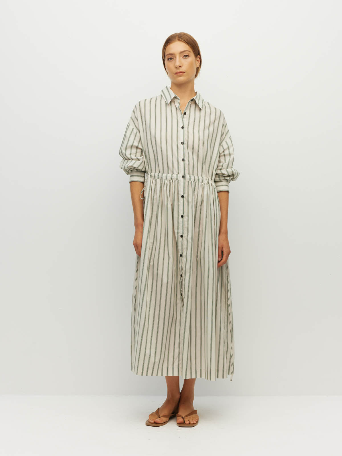 Juliette Hogan Lenora Dress (Batch Stripe Cotton) Pine Line - striped cotton shirtdress with shirt collar, full-length button sleeves, and drop waist with tie detail.