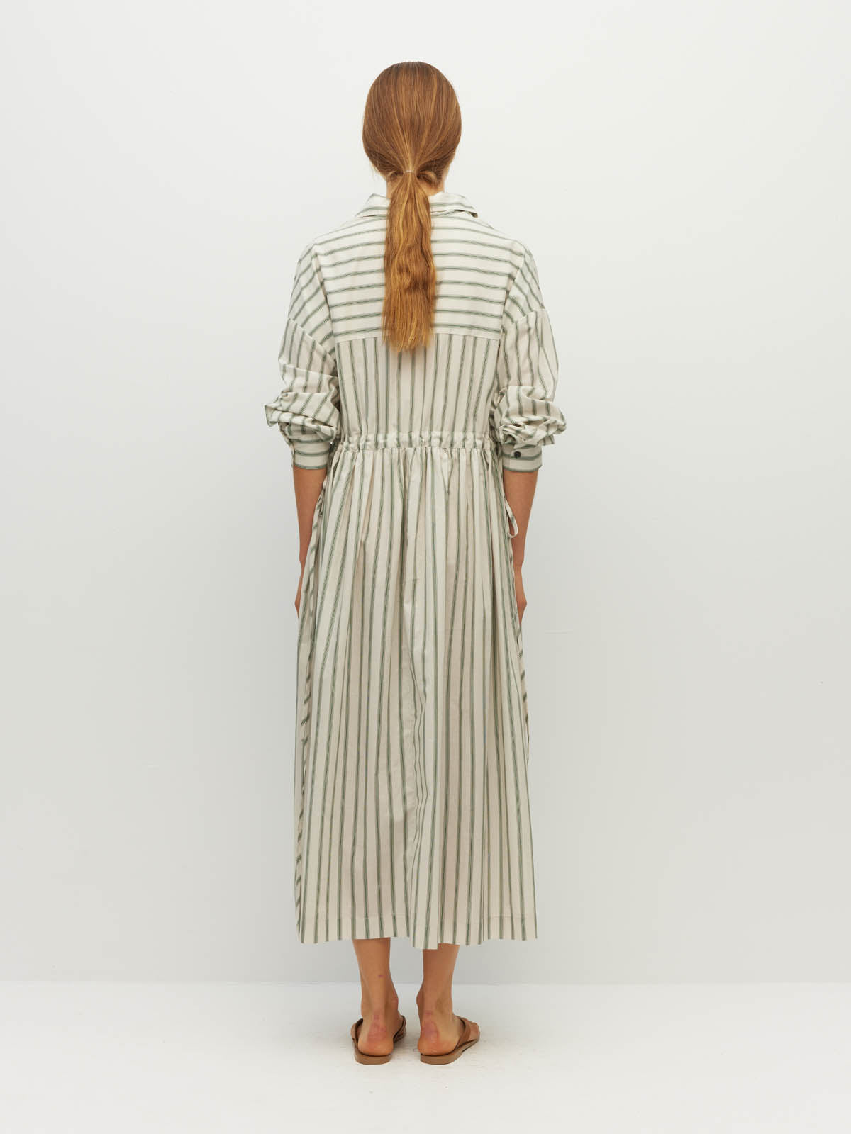 Juliette Hogan Lenora Dress (Batch Stripe Cotton) Pine Line - striped cotton shirtdress with shirt collar, full-length button sleeves, and drop waist with tie detail.