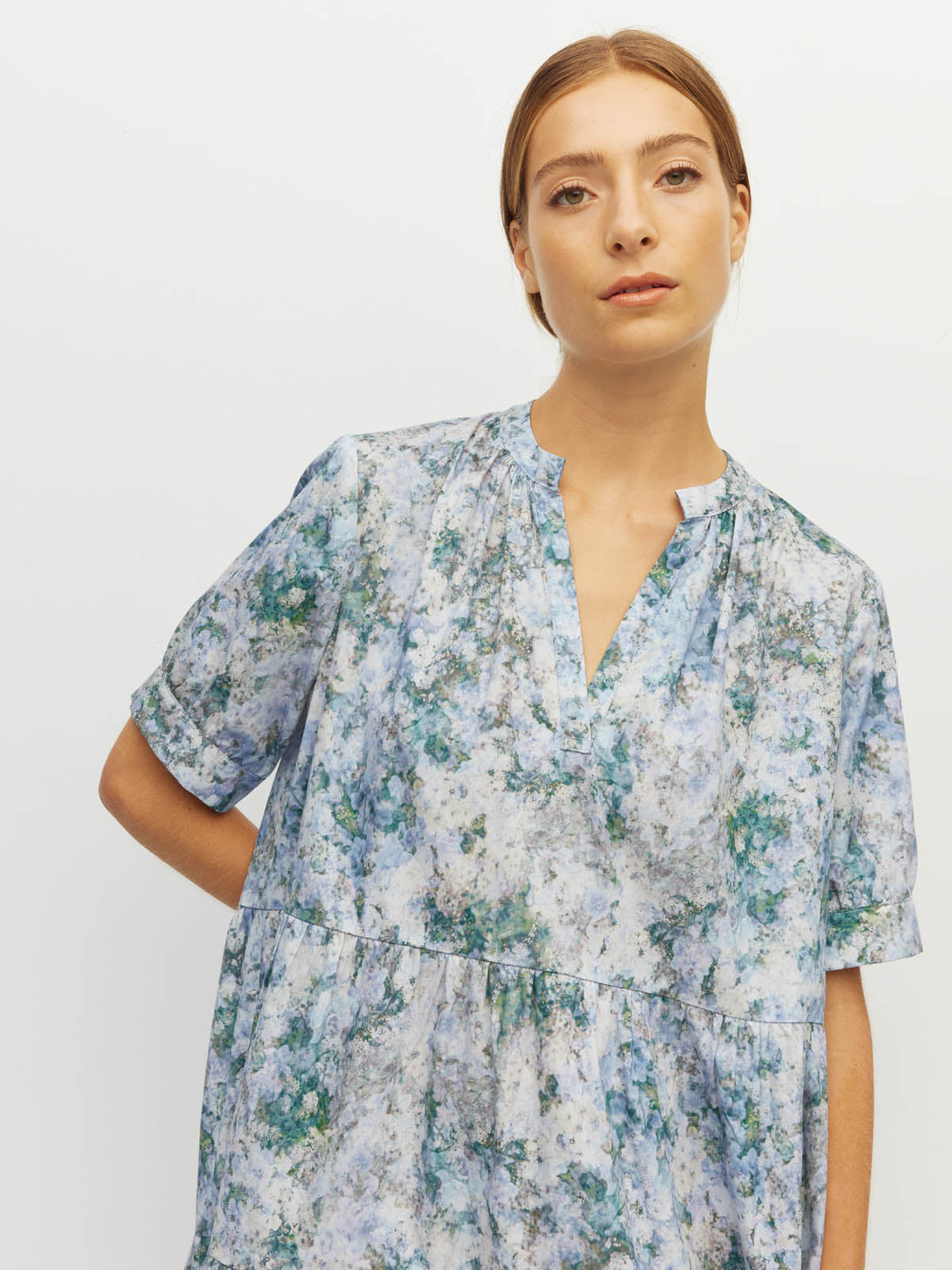 Juliette Hogan Eternal Tunic (Cloud Flower Cotton) Frosted Sky - tiered cotton midi dress with deep V-neck split and elbow-length cuffed sleeves, machine washable.