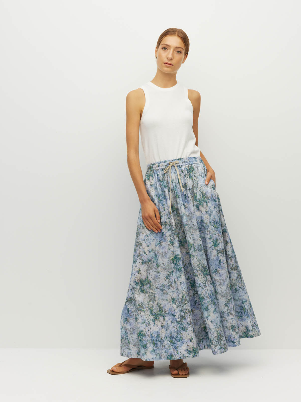 Juliette Hogan Kev Skirt (Cloud Flower Cotton) Frosted Sky - printed ankle-length cotton maxi skirt with elasticated drawcord waist, side pockets, and side splits.