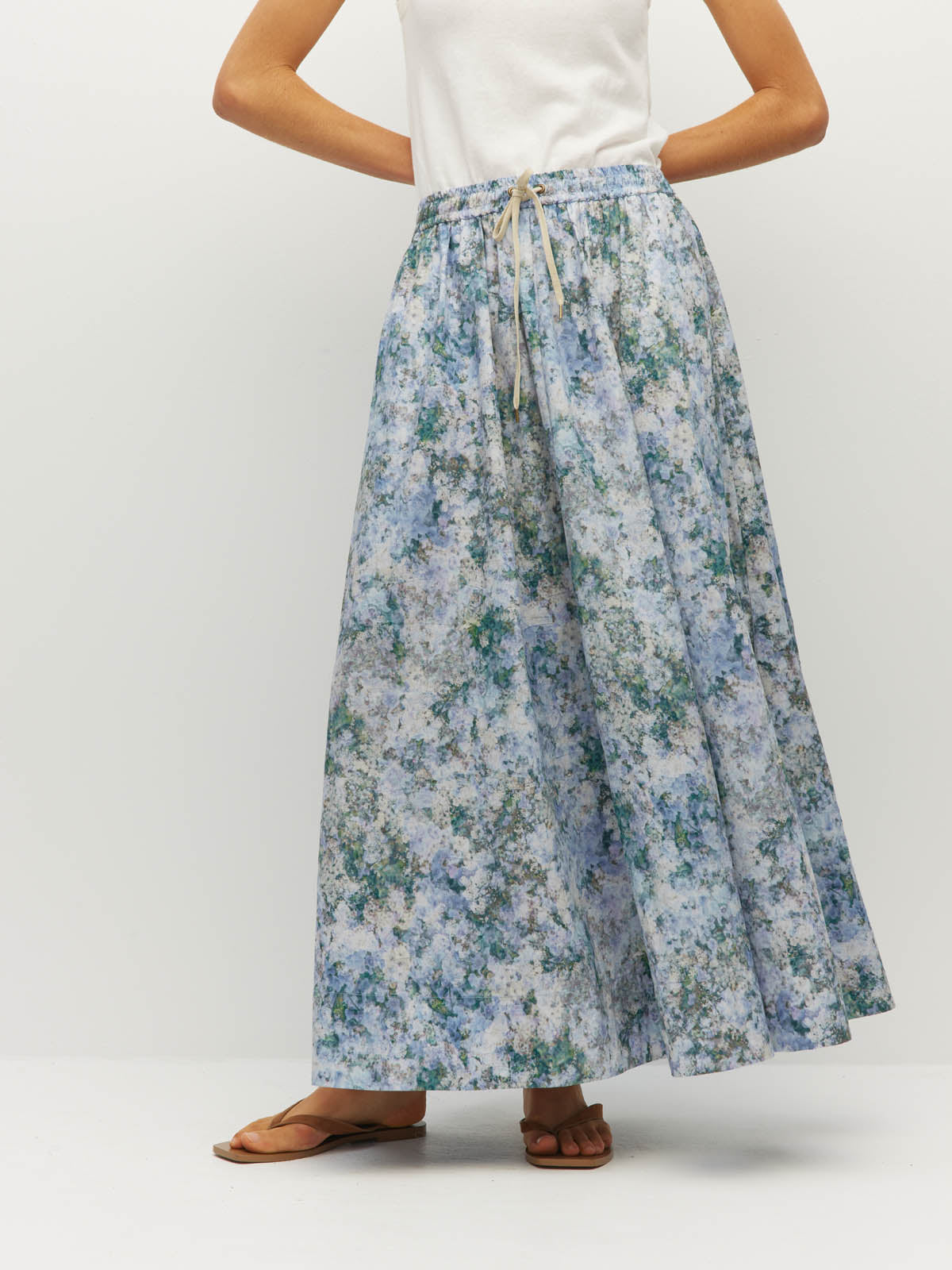 Juliette Hogan Kev Skirt (Cloud Flower Cotton) Frosted Sky - printed ankle-length cotton maxi skirt with elasticated drawcord waist, side pockets, and side splits.