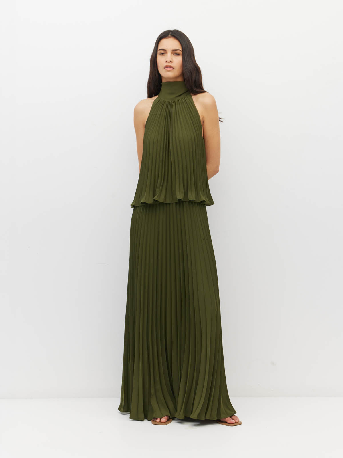 Juliette Hogan Amira Dress (Matte Pleat) Olive - pleated event dress with high tie neckline, elasticated waist, and ankle-length hem.
