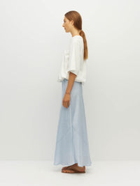 Juliette Hogan Em Skirt (Soft Matte Satin) Baby Blue Crush - bias-cut satin skirt with elastic waistband, lined, lower-calf hem.