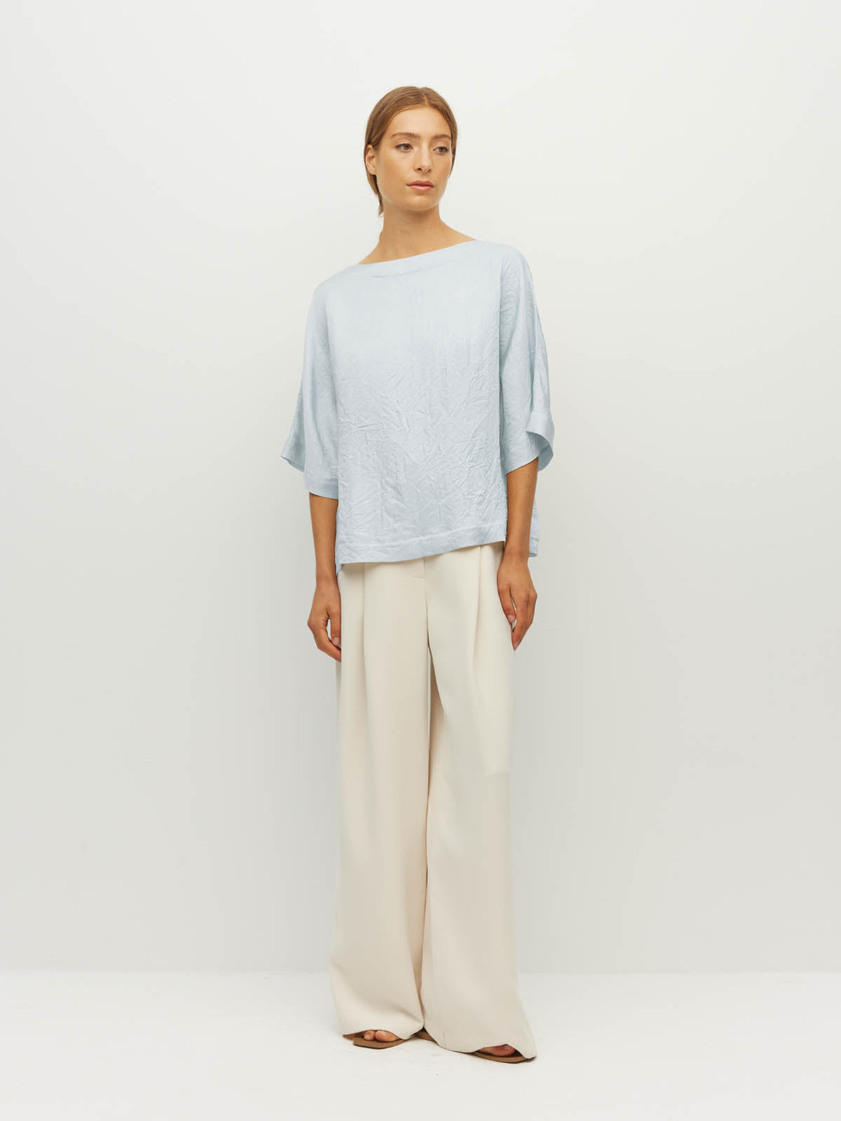Juliette Hogan Nami T (Soft Matte Satin) Baby Blue Crush - oversized satin top with boat neckline and wide kimono sleeves.