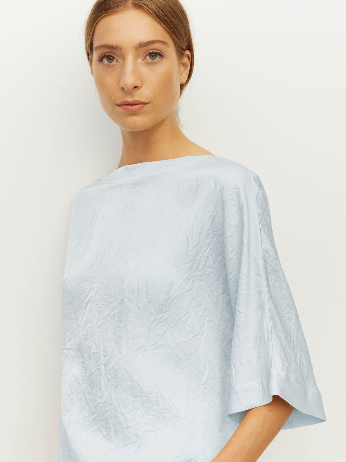 Juliette Hogan Nami T (Soft Matte Satin) Baby Blue Crush - oversized satin top with boat neckline and wide kimono sleeves.